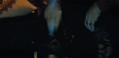 Person Smoking Hookah With Blue Smoke GIF
