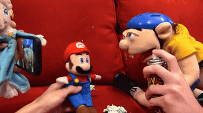 Person Spray Painting Stuffed Mario GIF