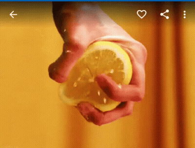 Person Squeezing Slice Of Lemon GIF