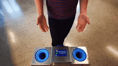 Person Standing Before Autoglove Machine GIF