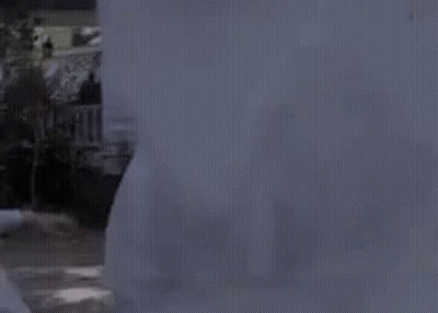 Person Standing Before Haunted House With Ghost GIF