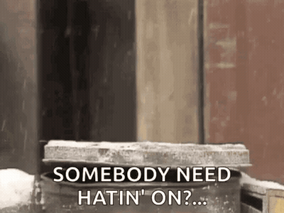 Person Standing By Trash Can Saying Somebody Need Hatin On GIF