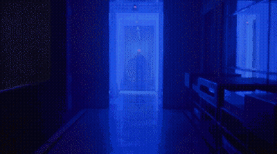 Person Standing In A Hallway GIF