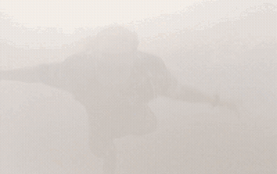 Person Standing In Clouds Feet In Air GIF