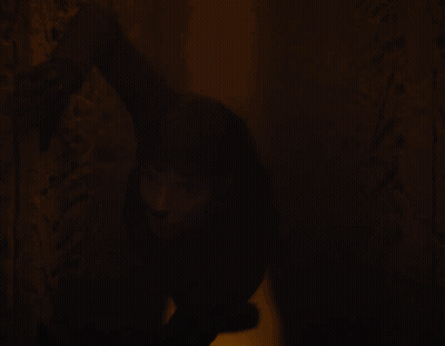 Person Standing In Dark Room GIF