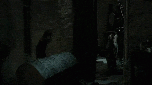 Person Standing In Dark Room GIF