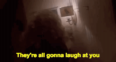 Person Standing In Dark Room With Laughing Words GIF