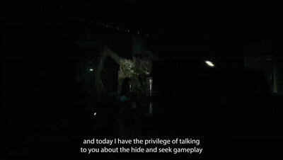 Person Standing In Dark Room With Monster GIF