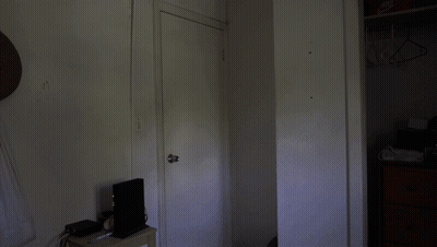 Person Standing In Dark Room With Nike Logo GIF