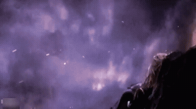 Person Standing In Dark Room With Purple Smoke GIF