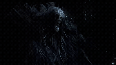Person Standing In Dark Room With Smoke GIF