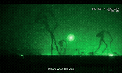 Person Standing In Dark With Green Light GIF