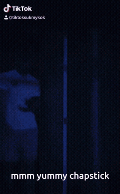 Person Standing In Doorway Saying Mmmm Yummy Chapstick GIF