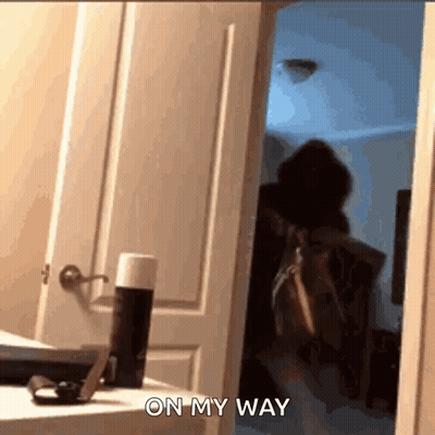 Person Standing In Doorway Saying On My Way GIF