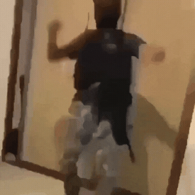 Person Standing In Doorway With Backpack GIF