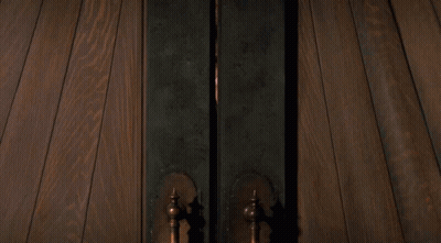 Person Standing In Doorway With Light GIF