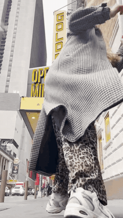 Person Standing In Front Of Building Saying Gold GIF