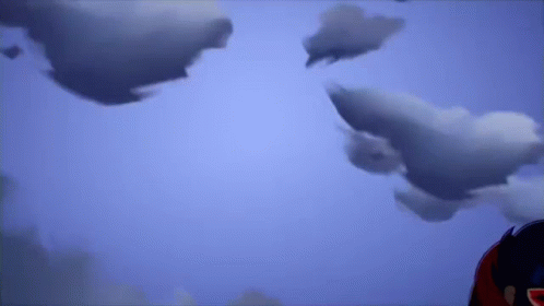 Person Standing In Front Of Cloudy Sky GIF