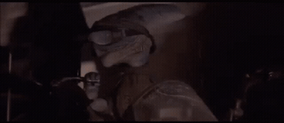 Person Standing In Front Of Huge Explosion GIF