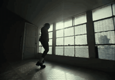 Person Standing In Front Of Large Window GIF