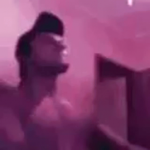 Person Standing In Front Of Pink Wall GIF