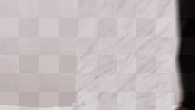 Person Standing In Front Of White Wall GIF