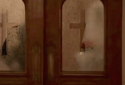 Person Standing In Front Of Window With Mirror GIF