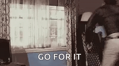 Person Standing In Living Room With Bag GIF