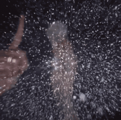 Person Standing In Pool Of Water With Bubbles GIF