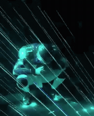 Person Standing In Rain In Dark Room With Glowing Lights GIF