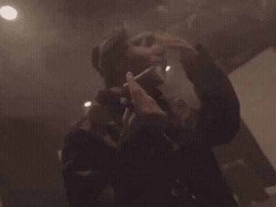 Person Standing In Room With Smoke Coming Out GIF