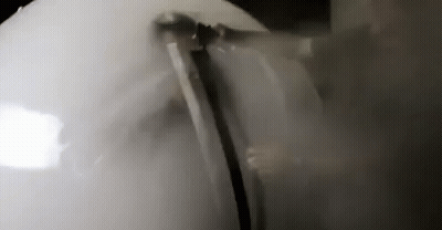 Person Standing In Room With Smoke GIF