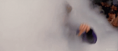 Person Standing In Smoke-Filled Room Holding Bottle GIF