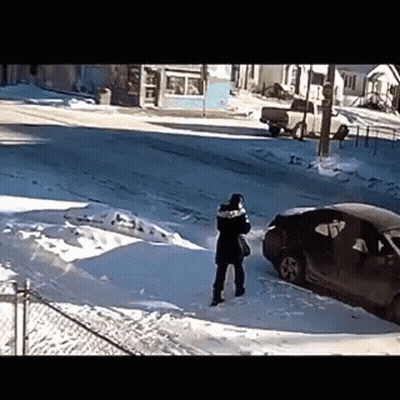 Person Standing In Snow Near Car GIF