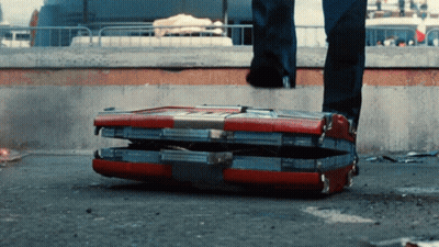 Person Standing Next To Open Briefcase GIF