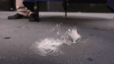 Person Standing Next To Thrown Can GIF