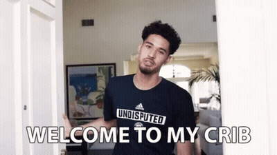Person Standing On Bed With Tablet GIF