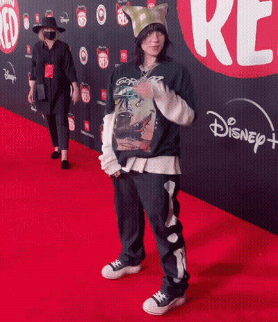 Person Standing On Disney Plus Red Carpet GIF
