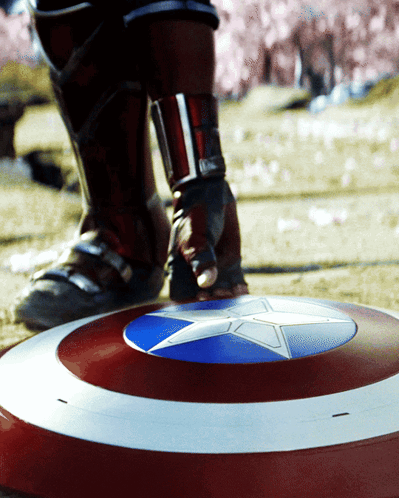 Person Standing On Shield With Blue Star GIF