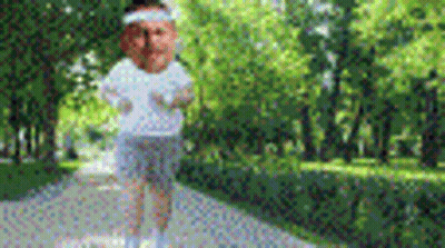 Person Standing On Sidewalk In Park GIF