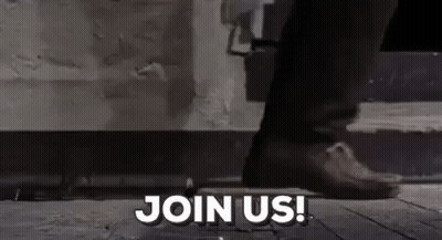 Person Standing On Sidewalk Saying Join Us GIF