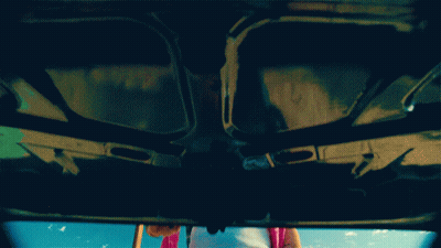 Person Standing Under Car Hood GIF