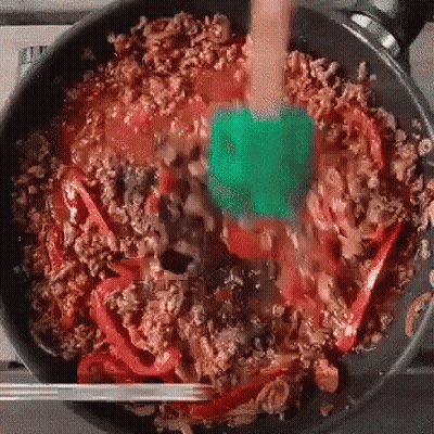 Person Stirring Food With Spatula GIF