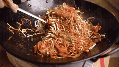 Person Stirring Noodles In Wok GIF