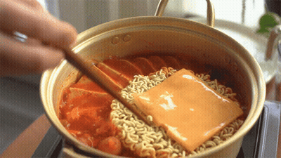 Person Stirring Pot Of Noodles With Cheese GIF