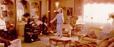 Person Surrounded By Flying Papers GIF