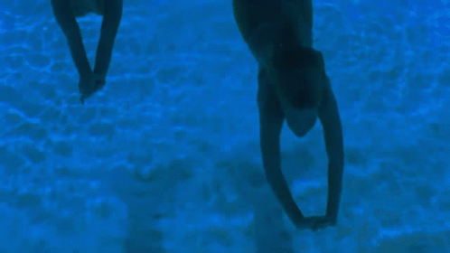 Person Swimming In Dark Pool GIF