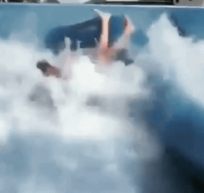 Person Swimming In Pool With Foam GIF