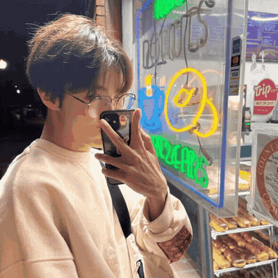 Person Taking Picture Of Donut Shop GIF