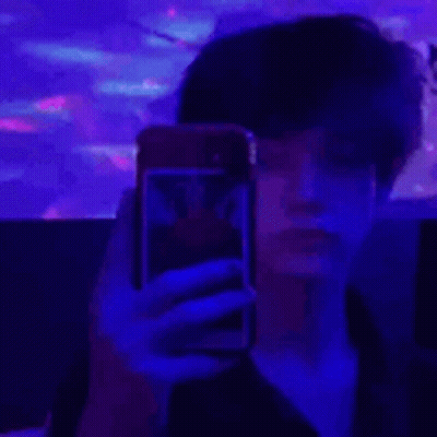 Person Taking Selfie On Purple Background GIF